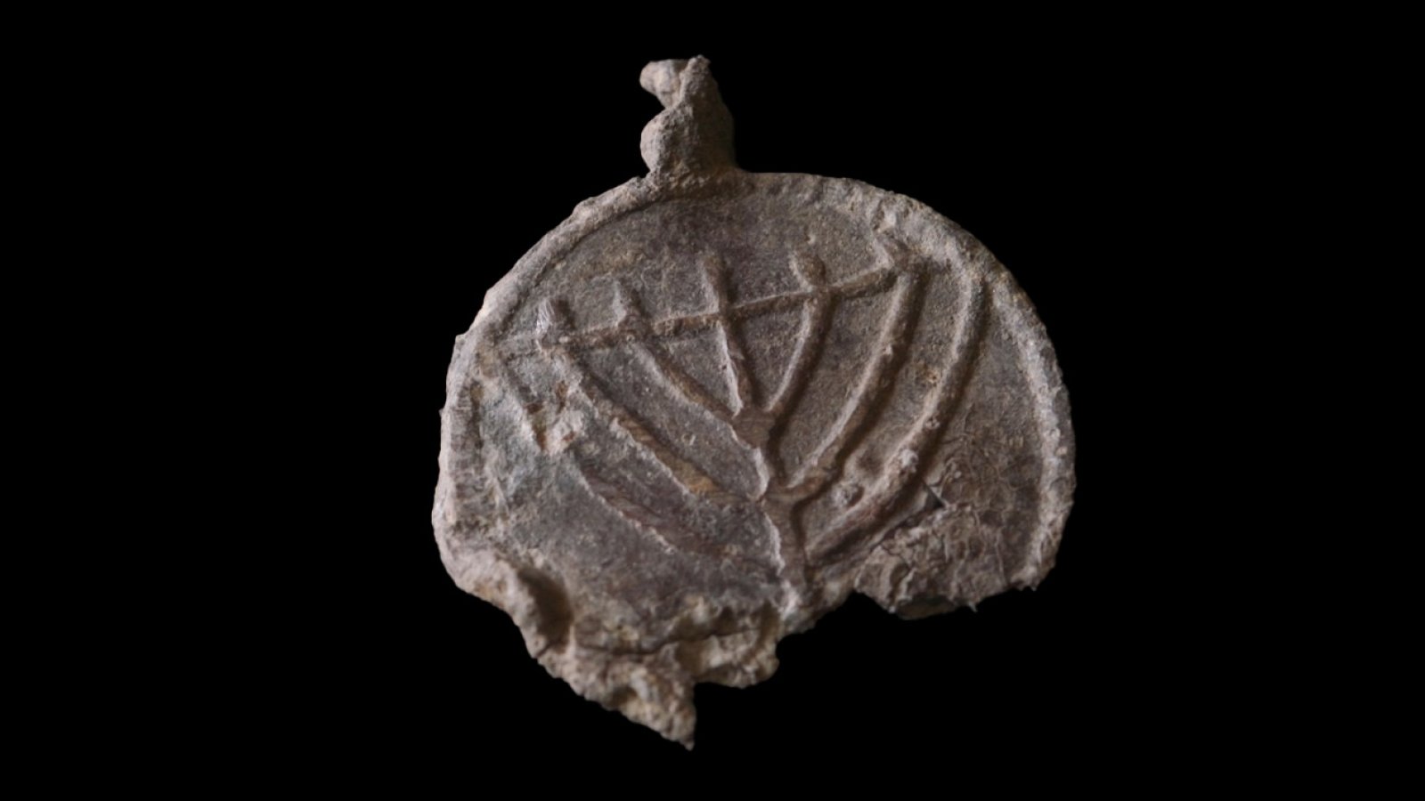 Rare 1,300-year-old medallion decorated with menorahs found near Jerusalem’s Temple Mount